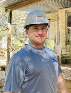 ALT="Edwin Nichols, pictured here in hard hat, is owner of Altitude Roofing in Austin."