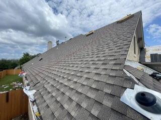 The front exterior of a beautiful Belterra home following a full roof replacement and a meticulous property clean-up