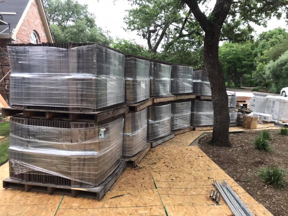 Experienced roofer securing the wood batten grid system required for concrete tile installation.